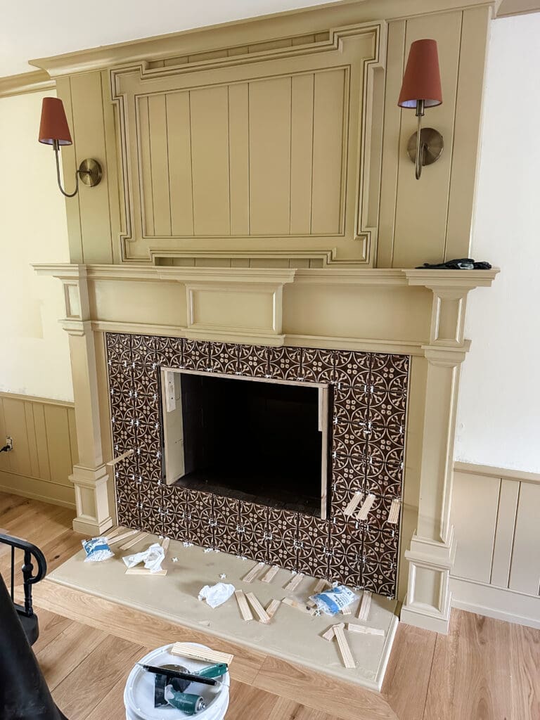 fireplace remodel with custom millwork in warm colors to create cozy home library